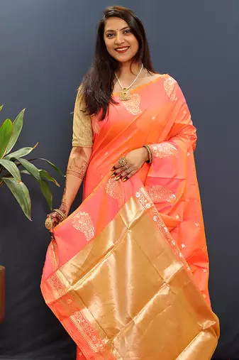 Peach silk blend banarasi saree with golden zari buti and border