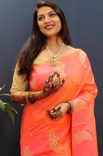 Peach silk blend banarasi saree with golden zari buti and border