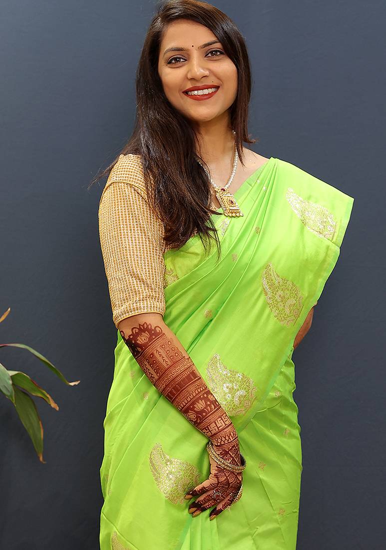 Lime green silk blend banarasi saree with golden zari buti and border