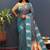 Teal blue silk blend banarasi saree with golden zari buti and border