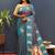 Teal blue silk blend banarasi saree with golden zari buti and border