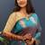 Teal blue silk blend banarasi saree with golden zari buti and border