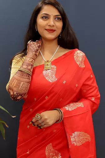 Red silk blend banarasi saree with golden zari buti and border