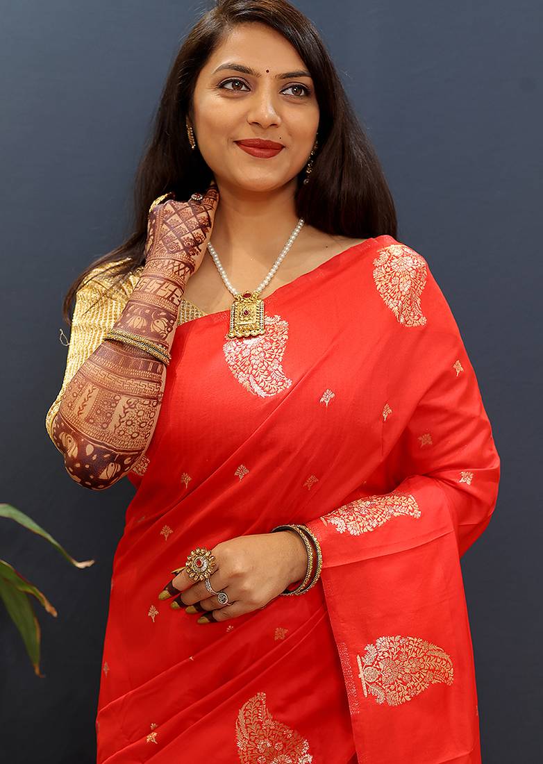 Red silk blend banarasi saree with golden zari buti and border