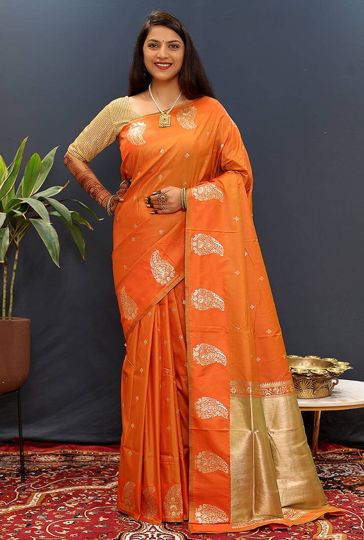 Orange silk blend banarasi saree with golden zari buti and border