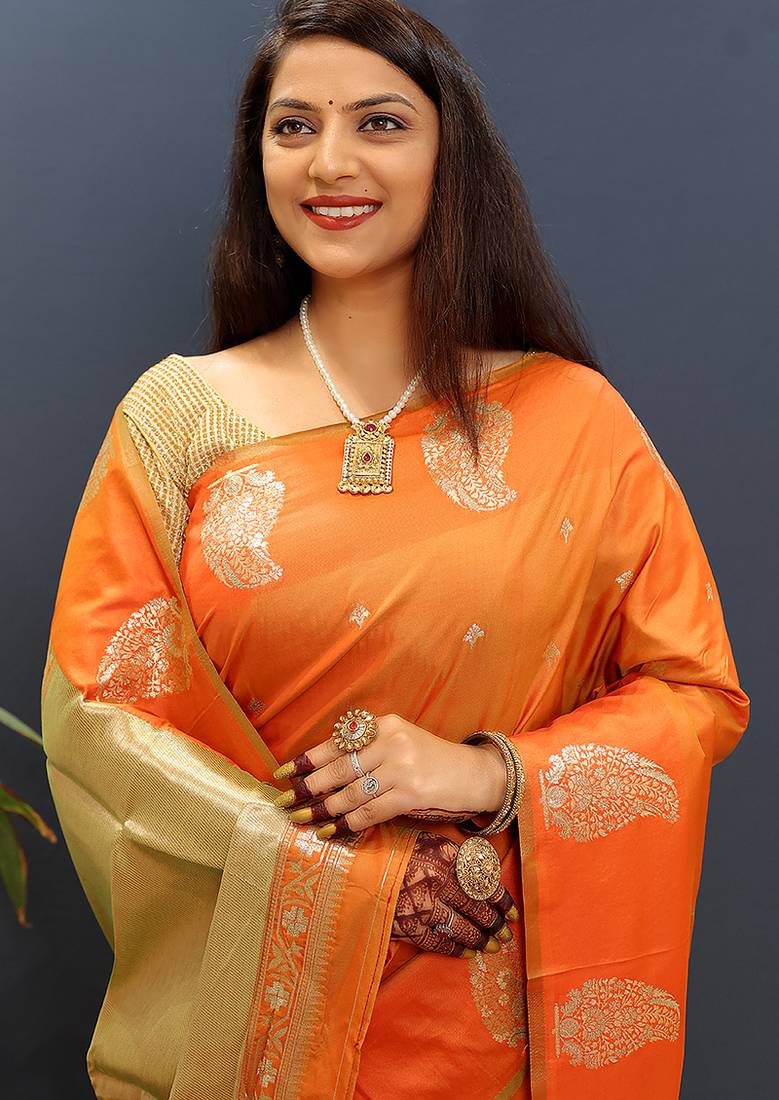 Orange silk blend banarasi saree with golden zari buti and border