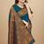 Teal blue silk blend banarasi saree with copper zari weaving, floral border