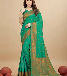 Sea green silk blend banarasi saree with copper zari weaving, floral border
