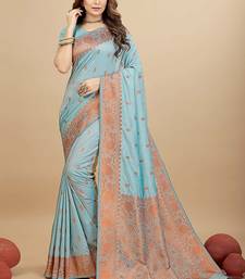 Sky blue silk blend banarasi saree with copper zari weaving, floral border