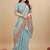Sky blue silk blend banarasi saree with copper zari weaving, floral border