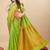 Parrot green silk blend banarasi saree with copper zari weaving, floral border
