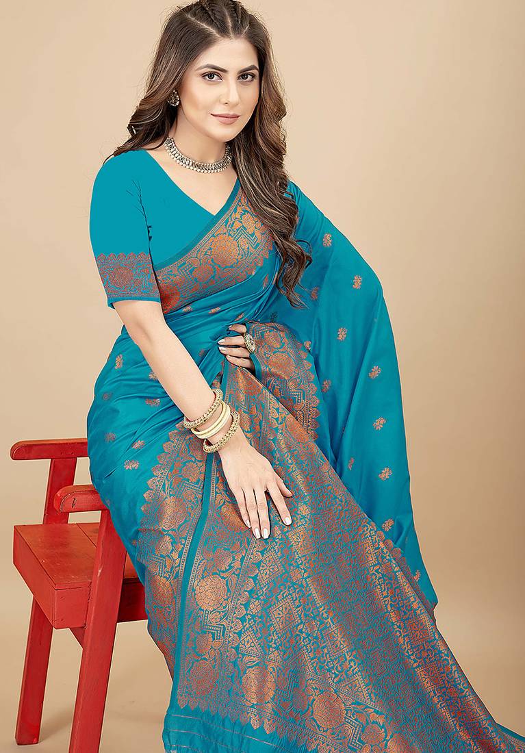 Sky blue silk blend banarasi saree with copper zari weaving, floral border