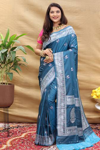 Teal blue silk blend banarasi saree with silver zari border and peacock pallu