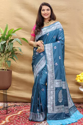 Teal blue silk blend banarasi saree with silver zari border and peacock pallu