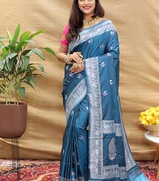 Teal blue silk blend banarasi saree with silver zari border and peacock pallu