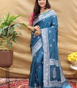 Teal blue silk blend banarasi saree with silver zari border and peacock pallu