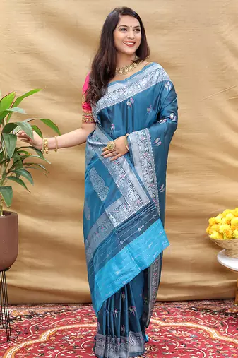 Teal blue silk blend banarasi saree with silver zari border and peacock pallu