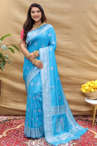 Sky blue silk blend banarasi saree with silver zari border and peacock pallu