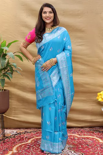 Sky blue silk blend banarasi saree with silver zari border and peacock pallu