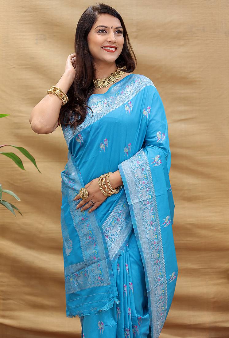 Sky blue silk blend banarasi saree with silver zari border and peacock pallu