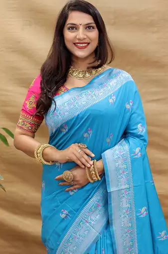 Sky blue silk blend banarasi saree with silver zari border and peacock pallu