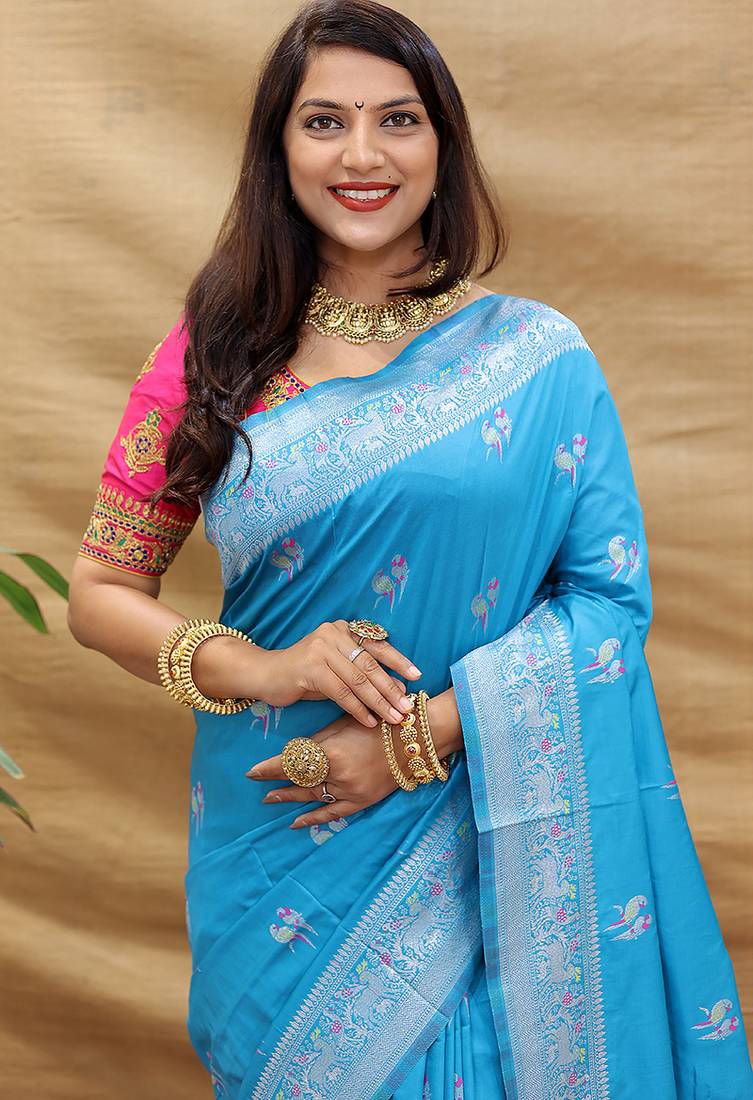 Sky blue silk blend banarasi saree with silver zari border and peacock pallu
