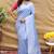 Lavender silk blend banarasi saree with silver zari border and peacock pallu
