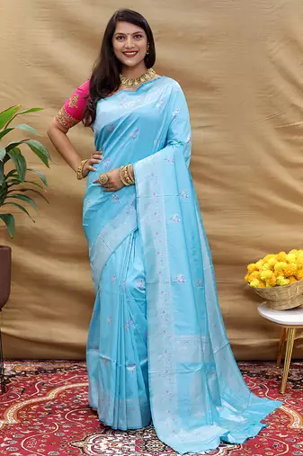 Sky blue silk blend banarasi saree with silver zari border and peacock pallu