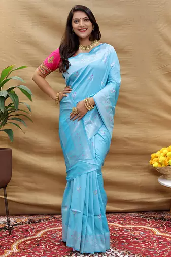 Sky blue silk blend banarasi saree with silver zari border and peacock pallu