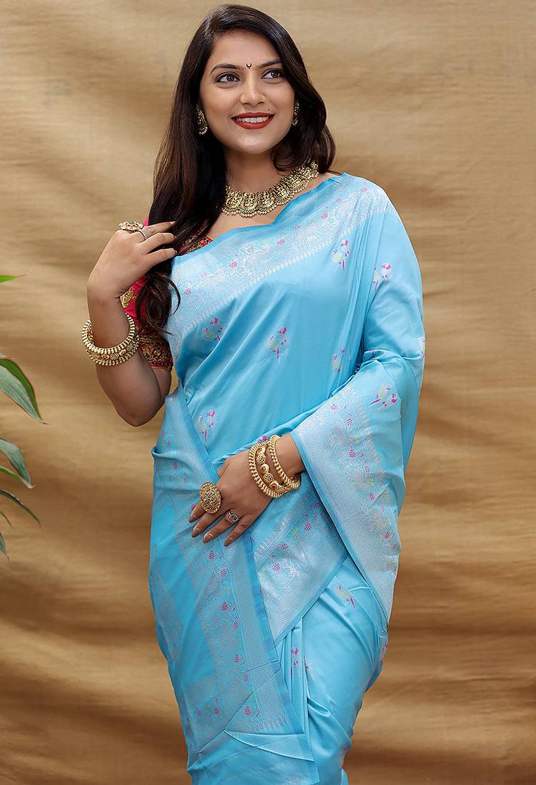 Sky blue silk blend banarasi saree with silver zari border and peacock pallu