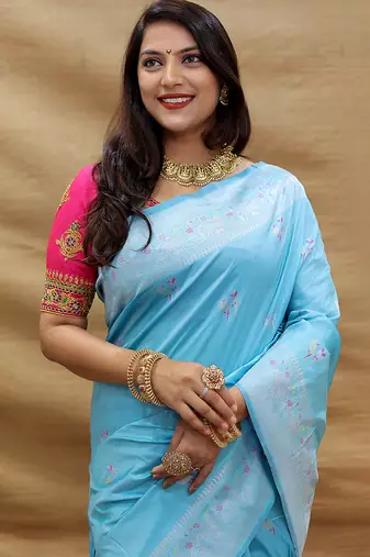 Sky blue silk blend banarasi saree with silver zari border and peacock pallu