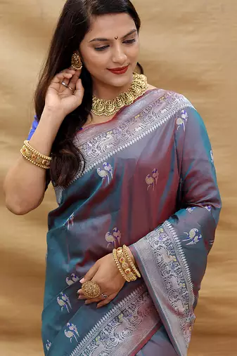 Grey silk blend banarasi saree with silver zari border and peacock pallu
