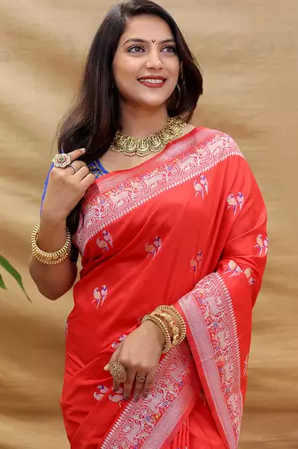 Red silk blend banarasi saree with silver zari border and peacock pallu