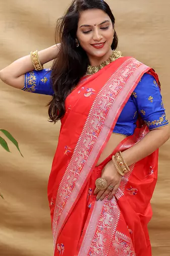 Red silk blend banarasi saree with silver zari border and peacock pallu