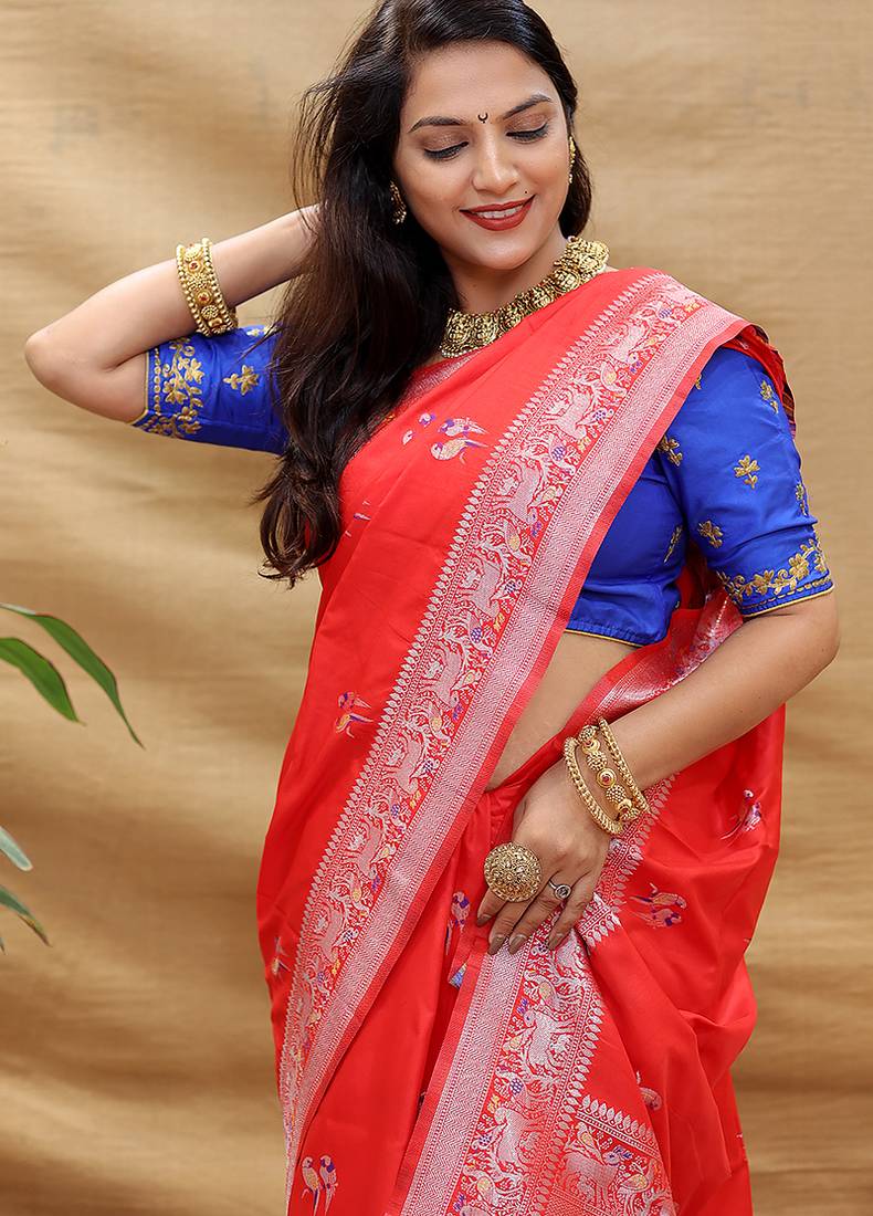 Red silk blend banarasi saree with silver zari border and peacock pallu