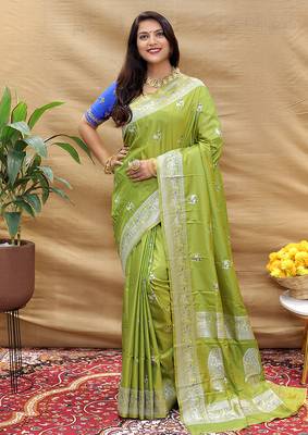 Light olive silk blend banarasi saree with silver zari border and peacock pallu 1