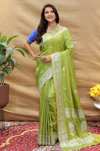 Light olive silk blend banarasi saree with silver zari border and peacock pallu
