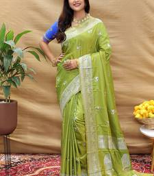 Light olive silk blend banarasi saree with silver zari border and peacock pallu