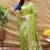 Light olive silk blend banarasi saree with silver zari border and peacock pallu