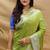 Light olive silk blend banarasi saree with silver zari border and peacock pallu