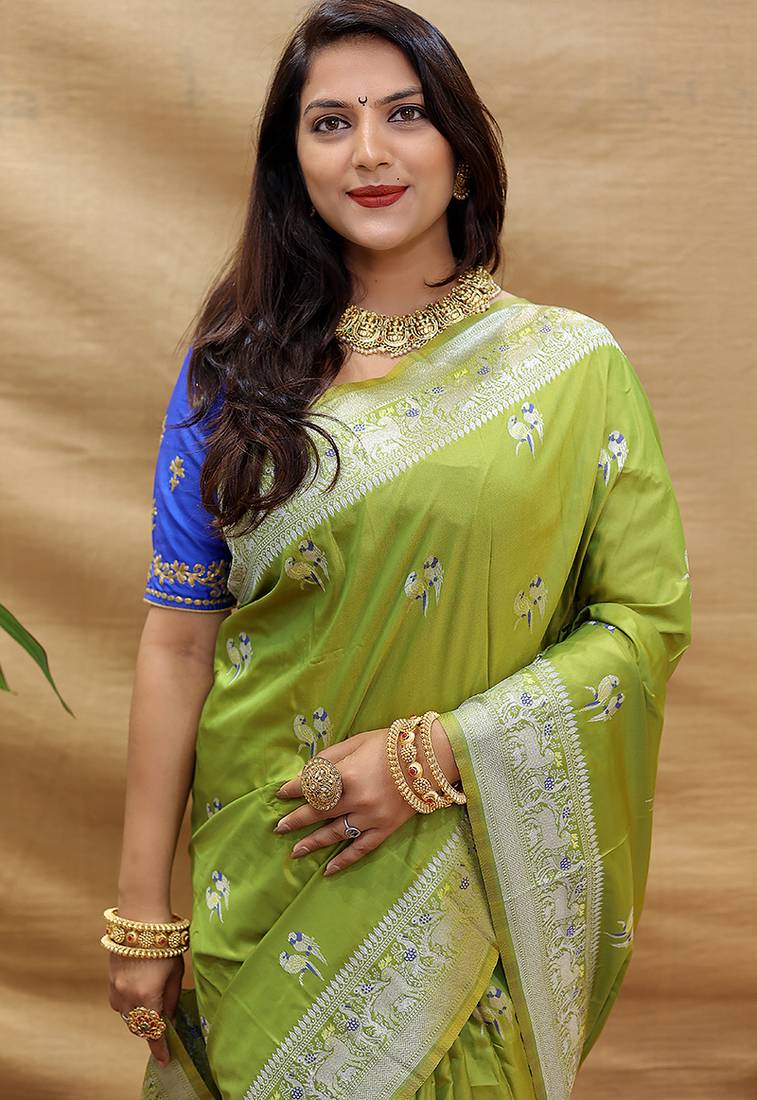 Light olive silk blend banarasi saree with silver zari border and peacock pallu