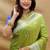 Light olive silk blend banarasi saree with silver zari border and peacock pallu