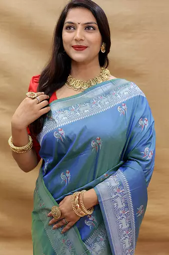 Blue silk blend banarasi saree with silver zari border and peacock pallu