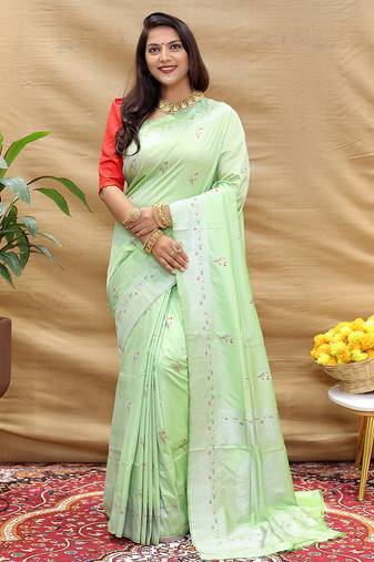 Mint green silk blend banarasi saree with silver zari border and peacock pallu
