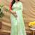 Mint green silk blend banarasi saree with silver zari border and peacock pallu