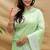 Mint green silk blend banarasi saree with silver zari border and peacock pallu