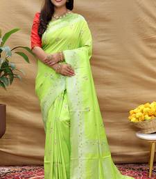 Lime green silk blend banarasi saree with silver zari border and peacock pallu