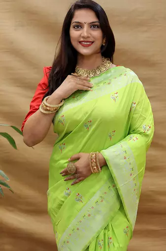 Lime green silk blend banarasi saree with silver zari border and peacock pallu