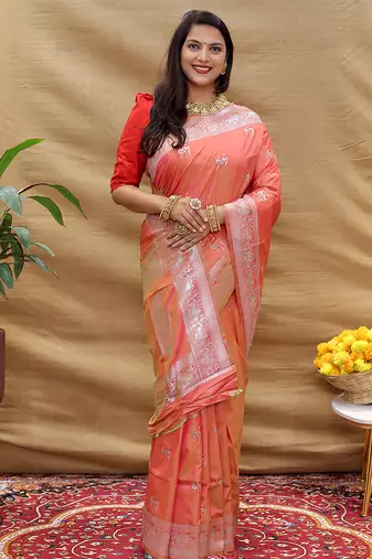 Peach silk blend banarasi saree with silver zari border and peacock pallu
