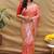 Peach silk blend banarasi saree with silver zari border and peacock pallu